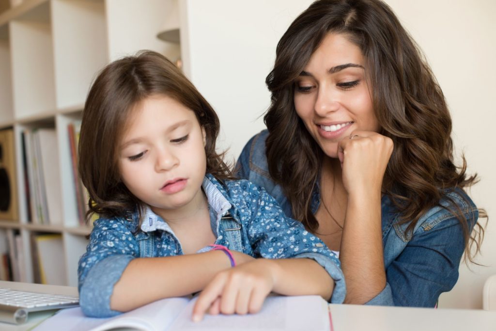 Mother Helping Child with Homework - KKRA - Seattle Wealth Management